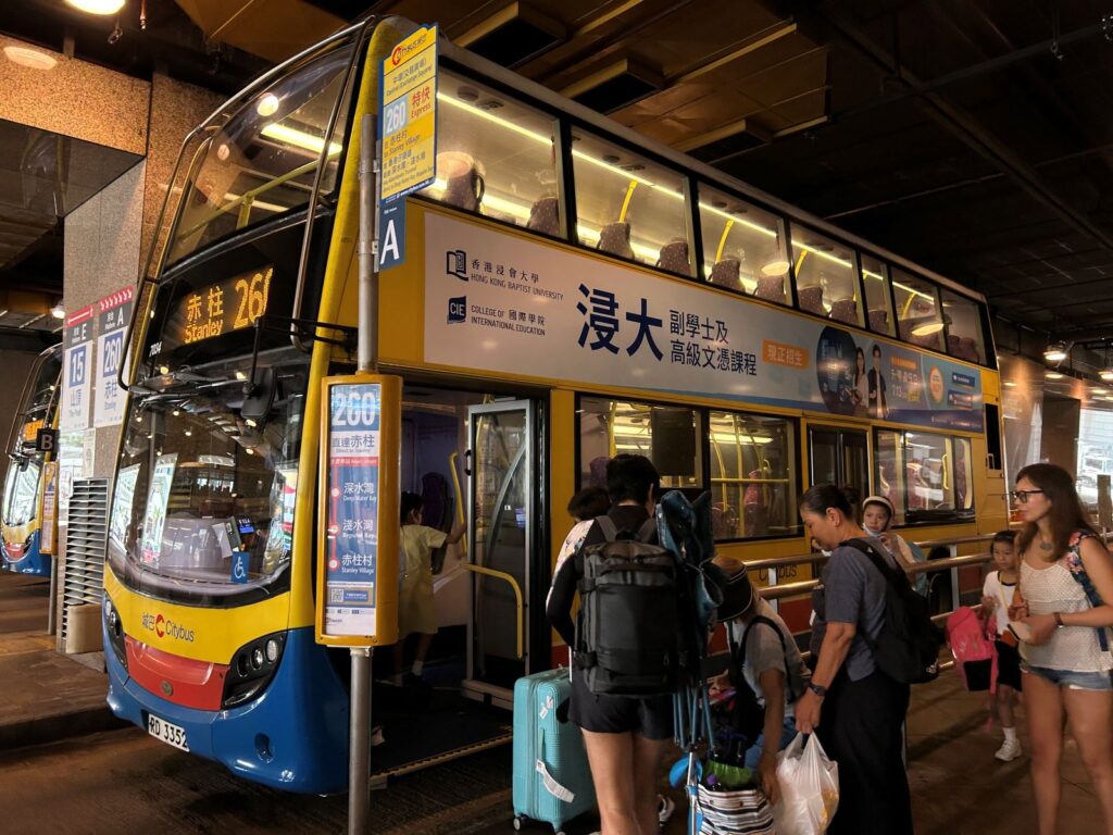 Passengers board the No. 260 double-decker to Stanley Market, Hong Kong.