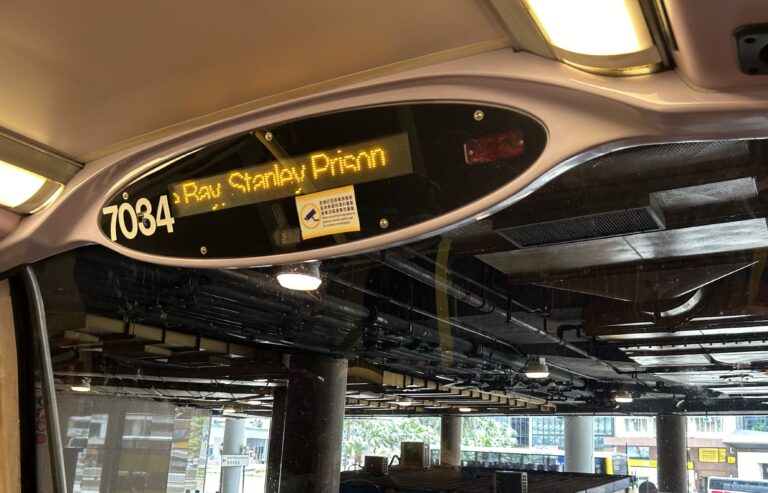 Electronic sign inside a double-decker bus, displaying the location, Stanley Prison, Hong Kong