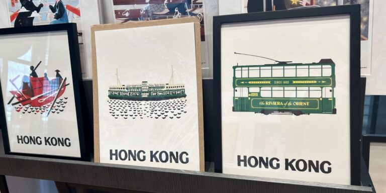 Set of framed art prints featuring iconic Hong Kong transport: a red sampan boat, the green Star Ferry, and a historic double-decker tram labeled "The Riviera of the Orient." Each minimalist print is labeled “HONG KONG,” making them stylish and recognizable souvenirs or gifts from the city.