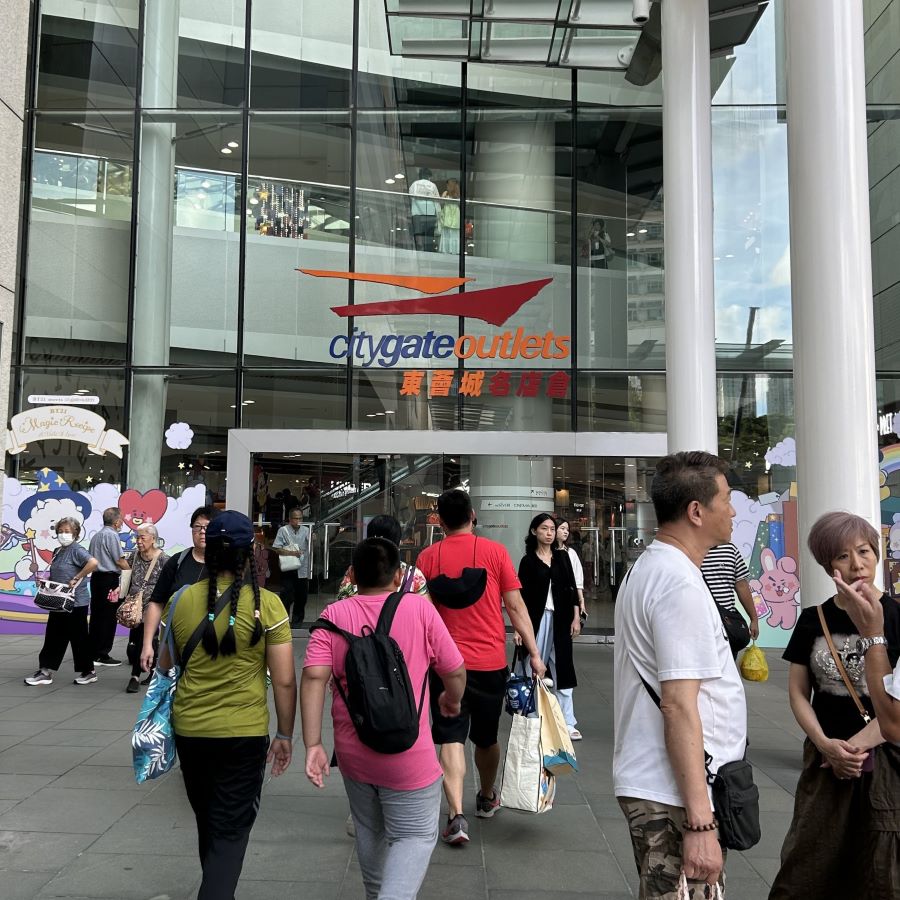 People enter the entrance to Citygate Outlet mall in Hong Kong.